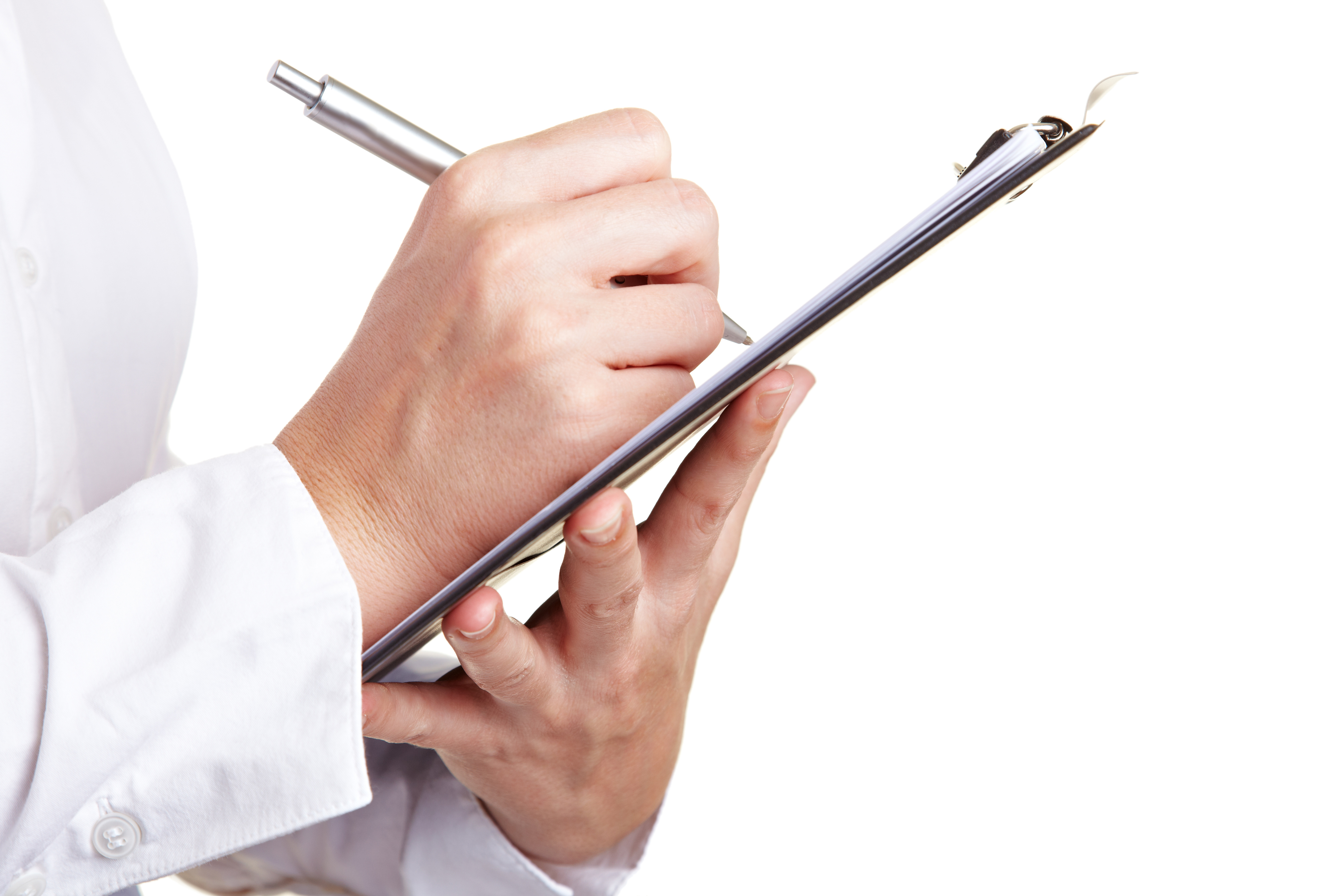 Hand filling out checklist on clipboard with a pen